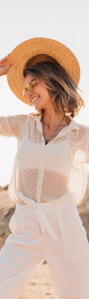 stylish-happy-attractive-smiling-woman-posing-desert-sand-dressed-white-clothes-wearing-straw-hat-sunglasses-sunset